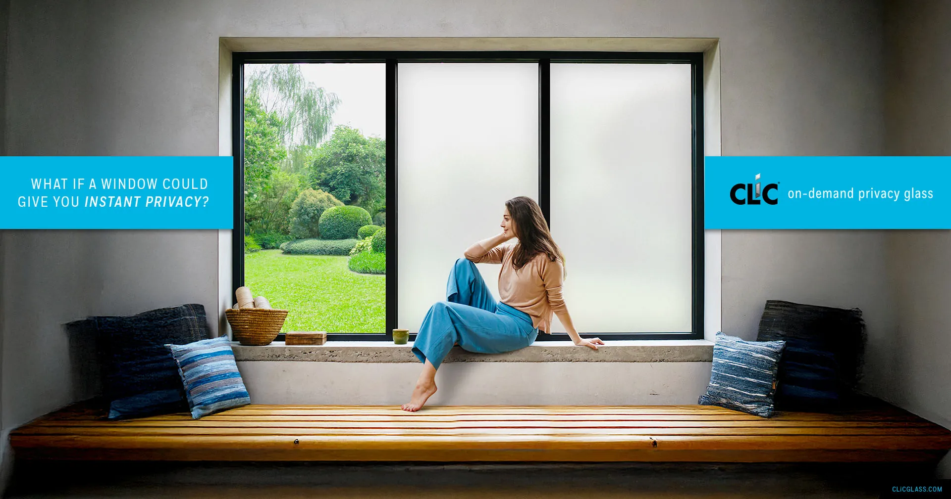 Woman sitting by window with CLiC glass — what if a window could give you instant privacy?
